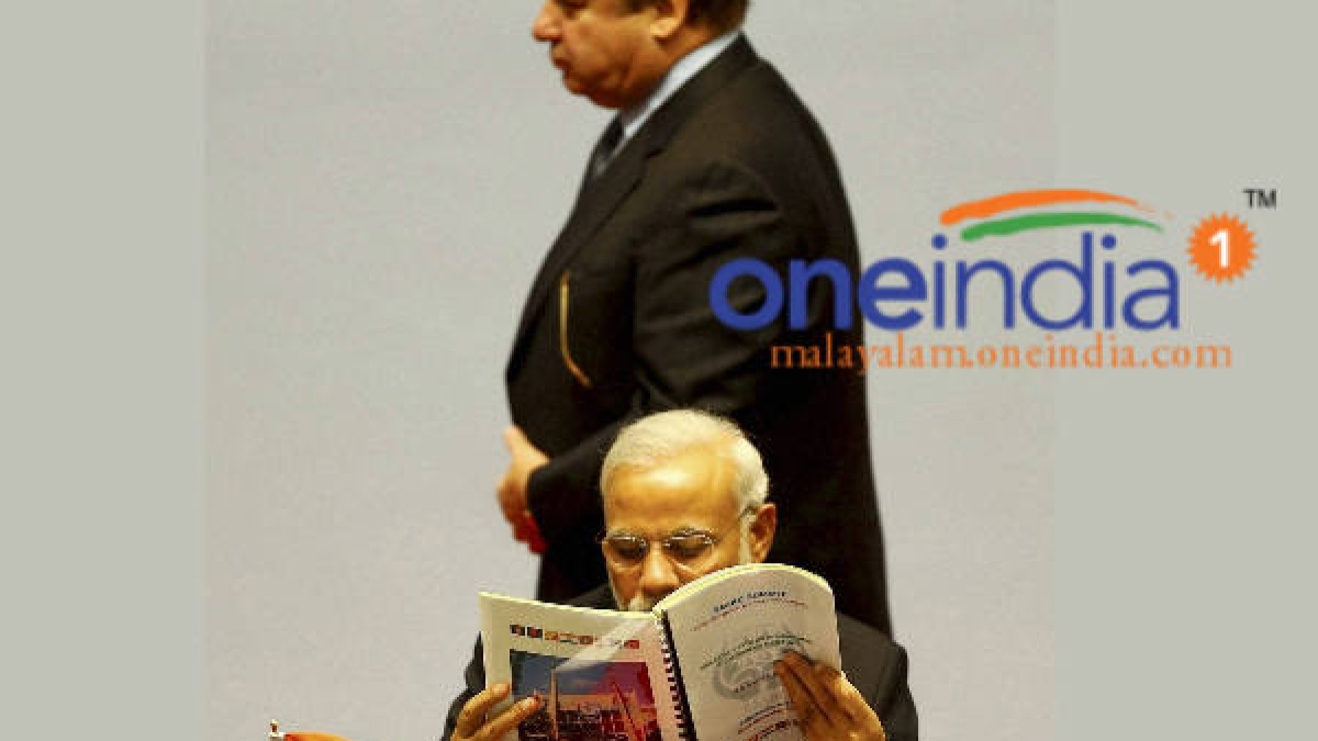 When Sharif walks for speech, Modi reads newspaper Malayalam Oneindia