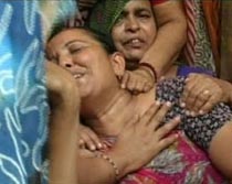 Milan Tanna's mother cries after getting the news that his son had died.