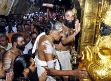 Melsanthi Easwaran Namboodiri opening the sanctum sanctorum