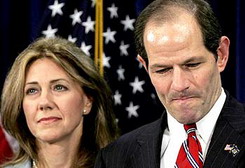 Mr Spitzer apologises in front of his wife 