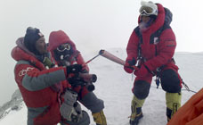 Olympic torch lit on Everest peak
