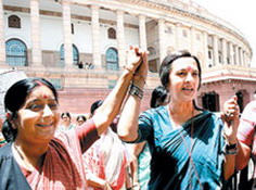 BJP leader Sushma Swaraj, CPM MP Brinda Karat and other MPs celebrate the presentation of Women's Reservation Bill in Parliament