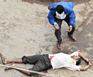  man rushes to help an injured person during farmers