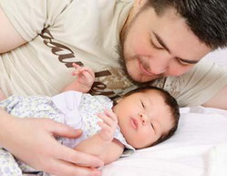 Thomas Beatie with his baby