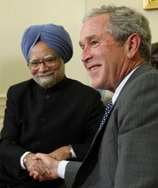 President Bush assured PM Manmohan Singh that he is trying hard to get the deal through the US Congress